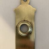 Door handle plate with brass keyhole