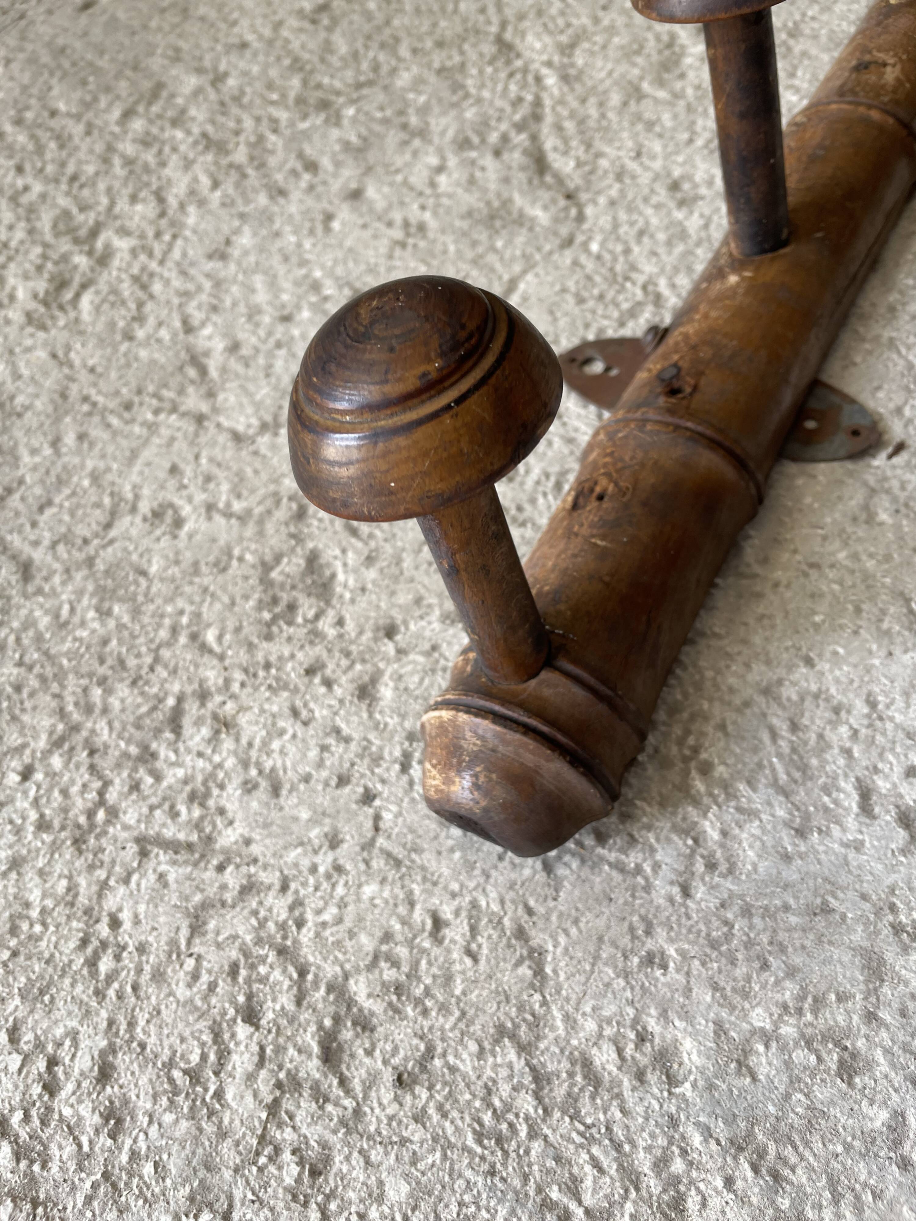 Old wooden wall coat rack
