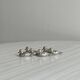 Set of 6 silver-plated metal ducks, name holders and knife rests.