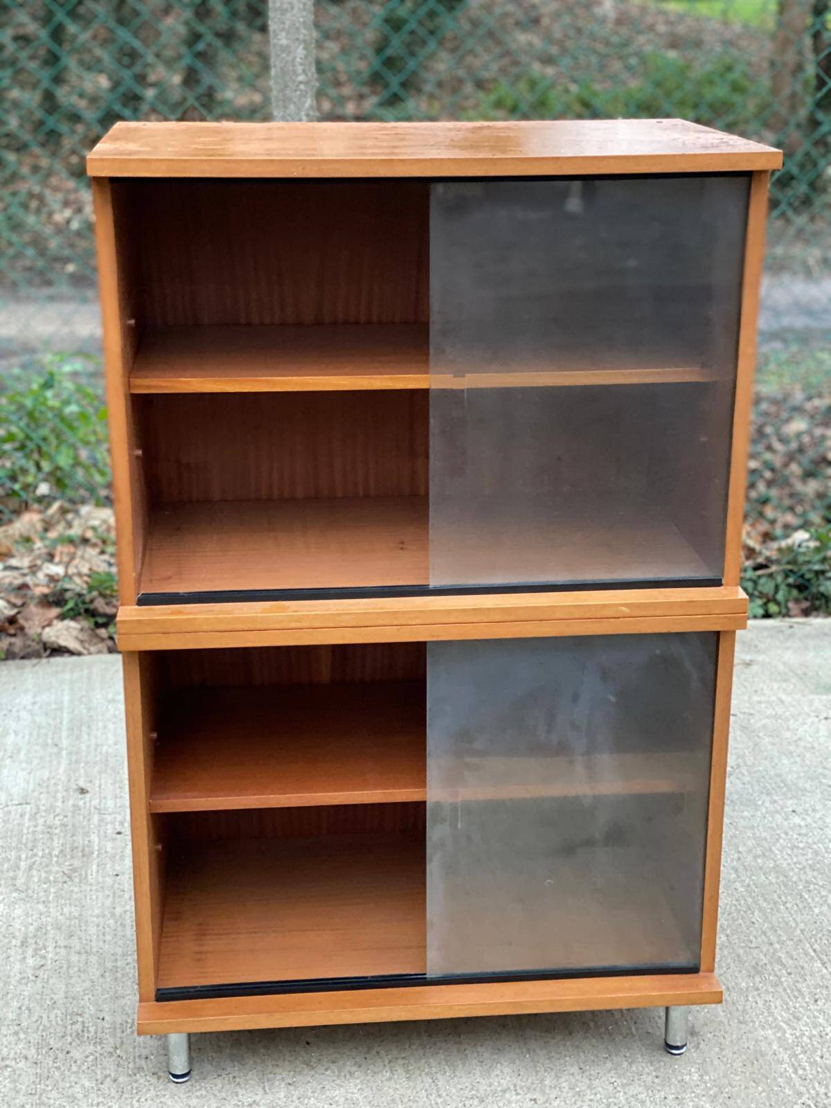 Scandinavian wooden buffet cabinet with sliding glass doors.