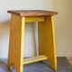 Art-populaire workshop stool in patinated painted wood