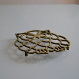 Vintage openwork brass trivet in the shape of an owl or owl