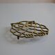 Vintage openwork brass trivet in the shape of an owl or owl