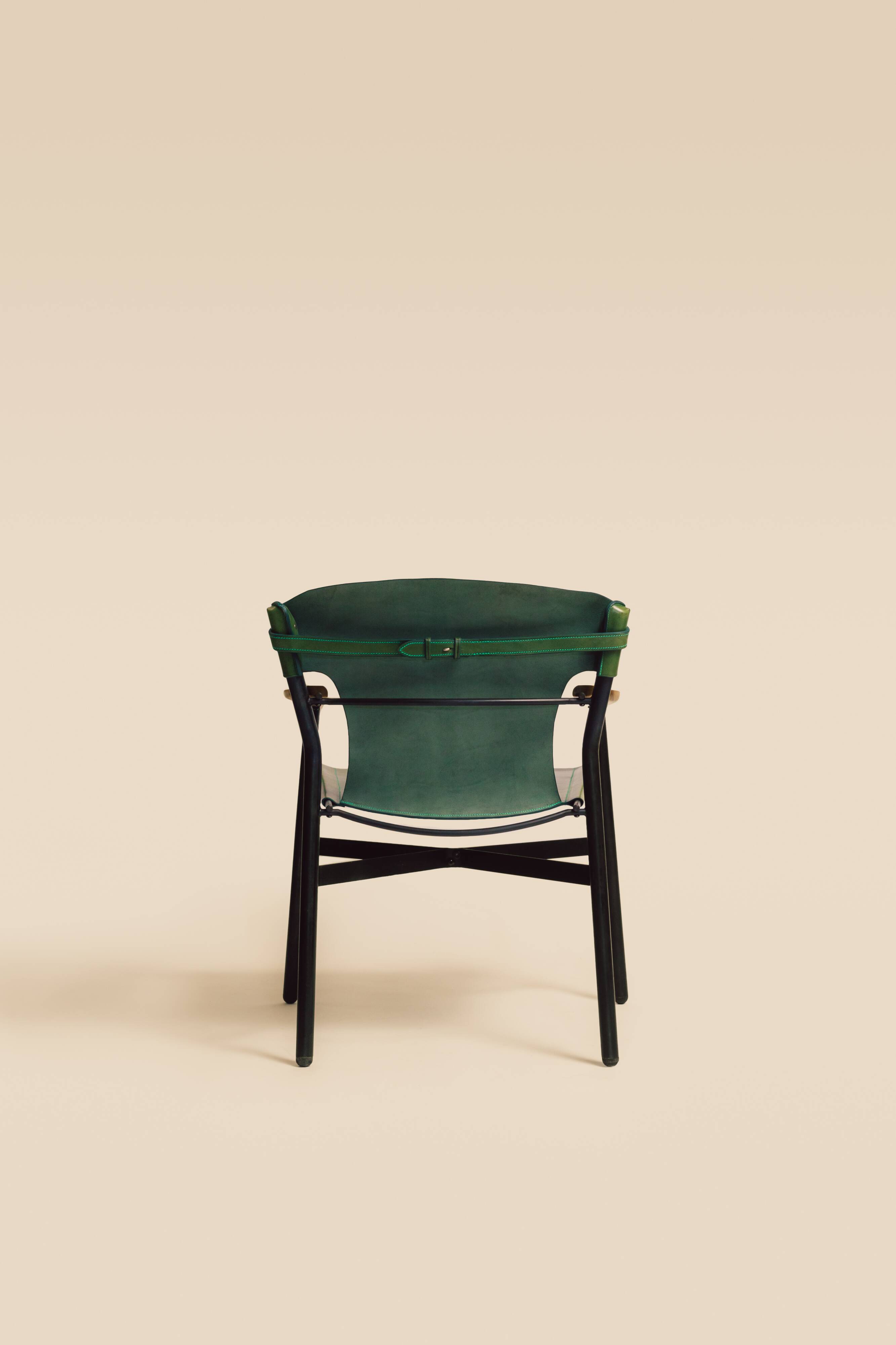 Maërl armchair, Galathée model, green leather, solid wood armrests of your choice