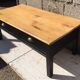 Table basse en merisier patinée noire et dessus en bois brut vernis mat