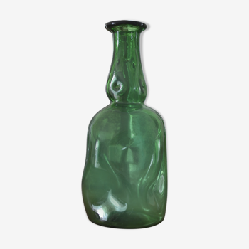 Dented green bottle
