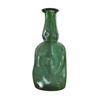 Dented green bottle