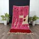 Handmade pure wool rug in pink, size 150 x 250 cm.