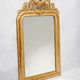 Louis-Philippe mirror from the 19th century with vase and crown of flowers.