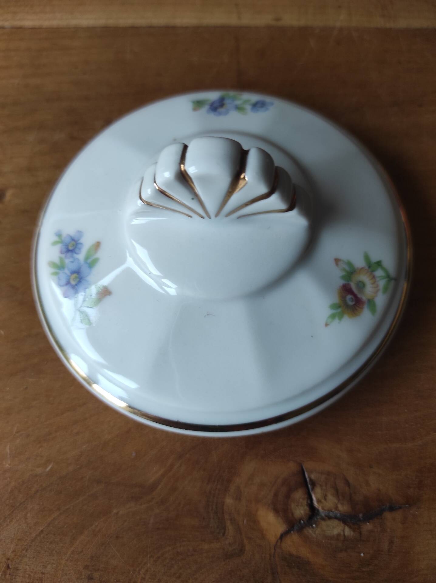 Antique porcelain sugar bowl with a decagonal base.
