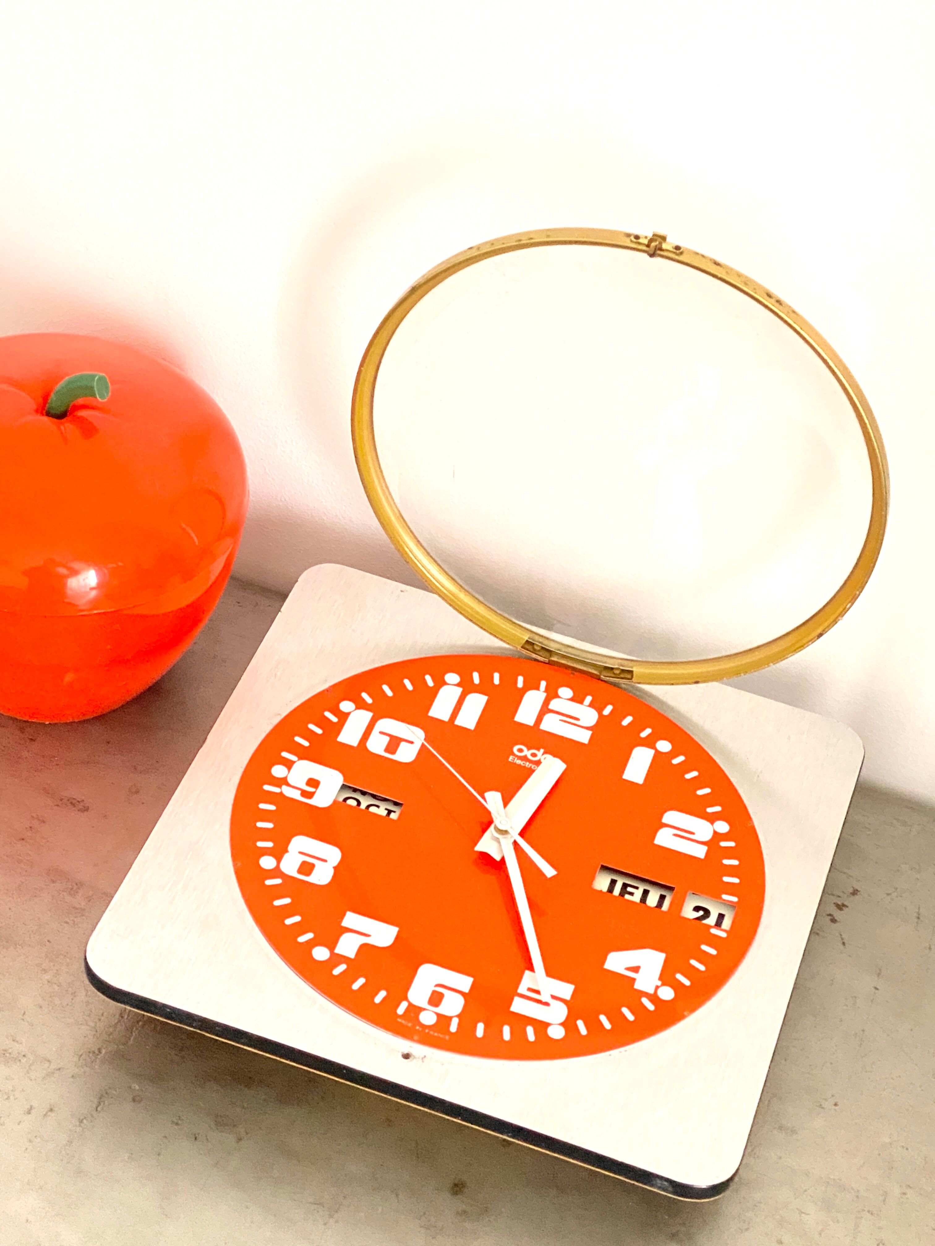 Vintage orange wall clock