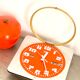 Vintage orange wall clock