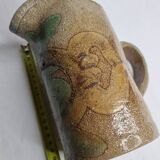 Handcrafted glazed stoneware pitcher decorated by hand