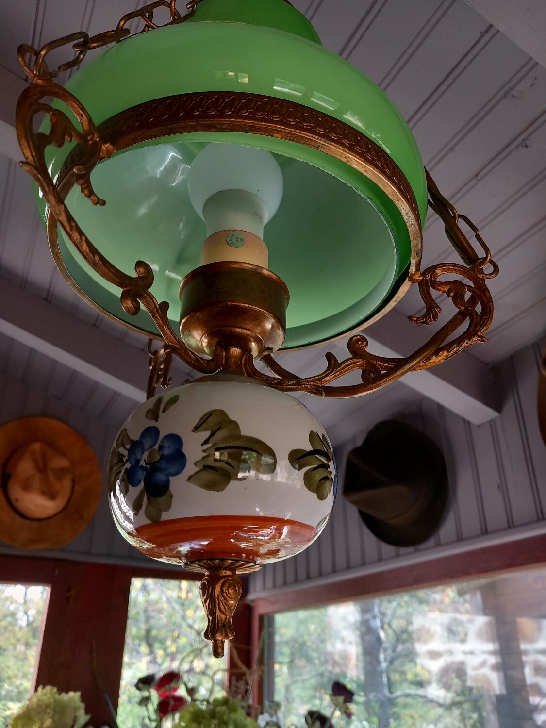 Old green opaline chandelier, gold metal and earthenware