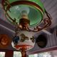 Old green opaline chandelier, gold metal and earthenware