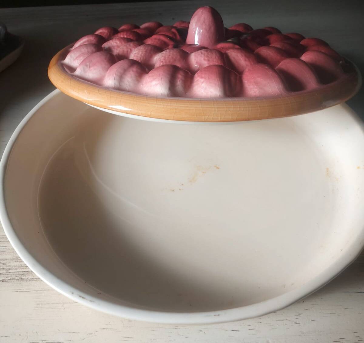 Glazed ceramic dessert plate with strawberry design.