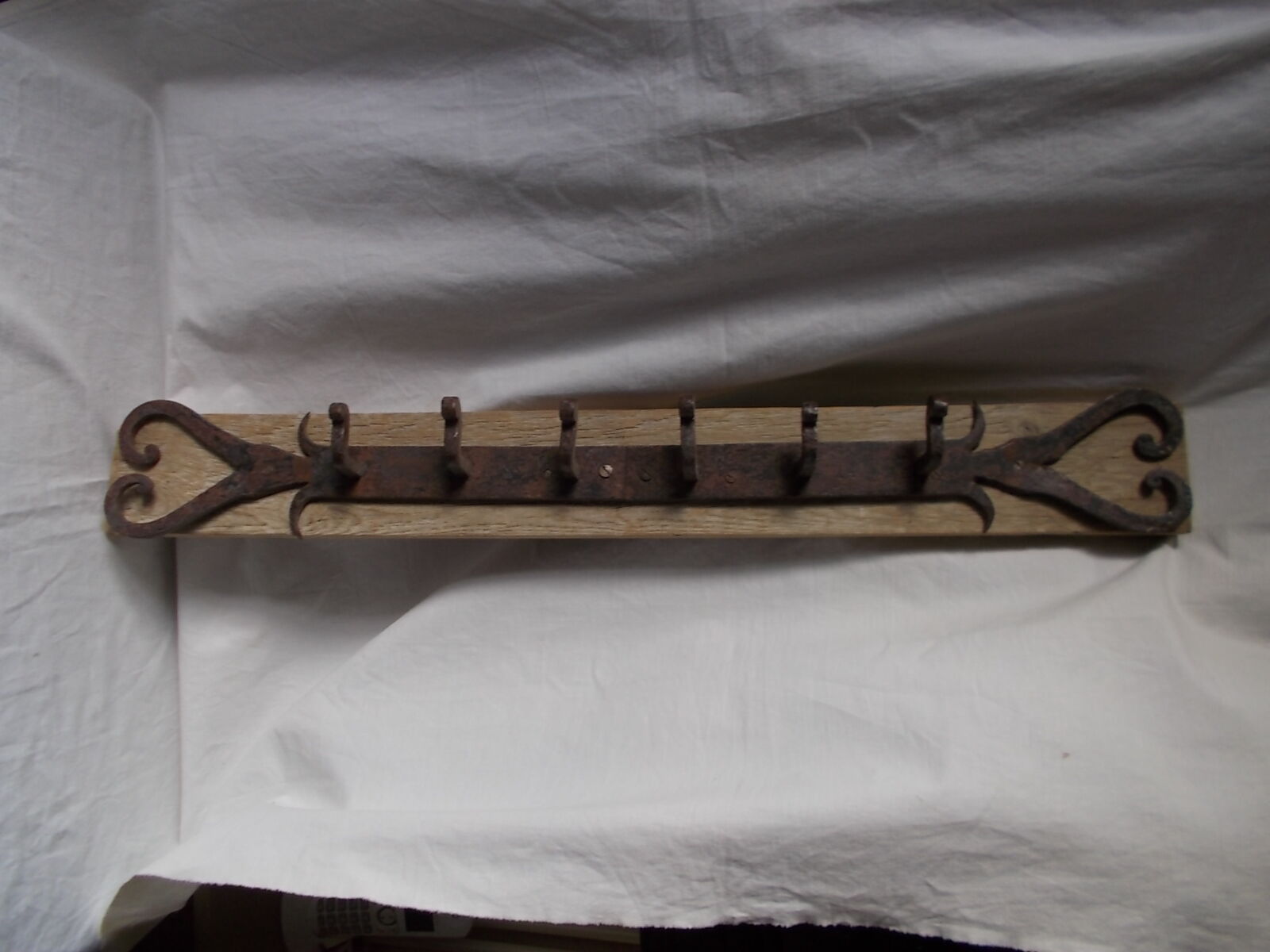 Wrought iron and wooden rack