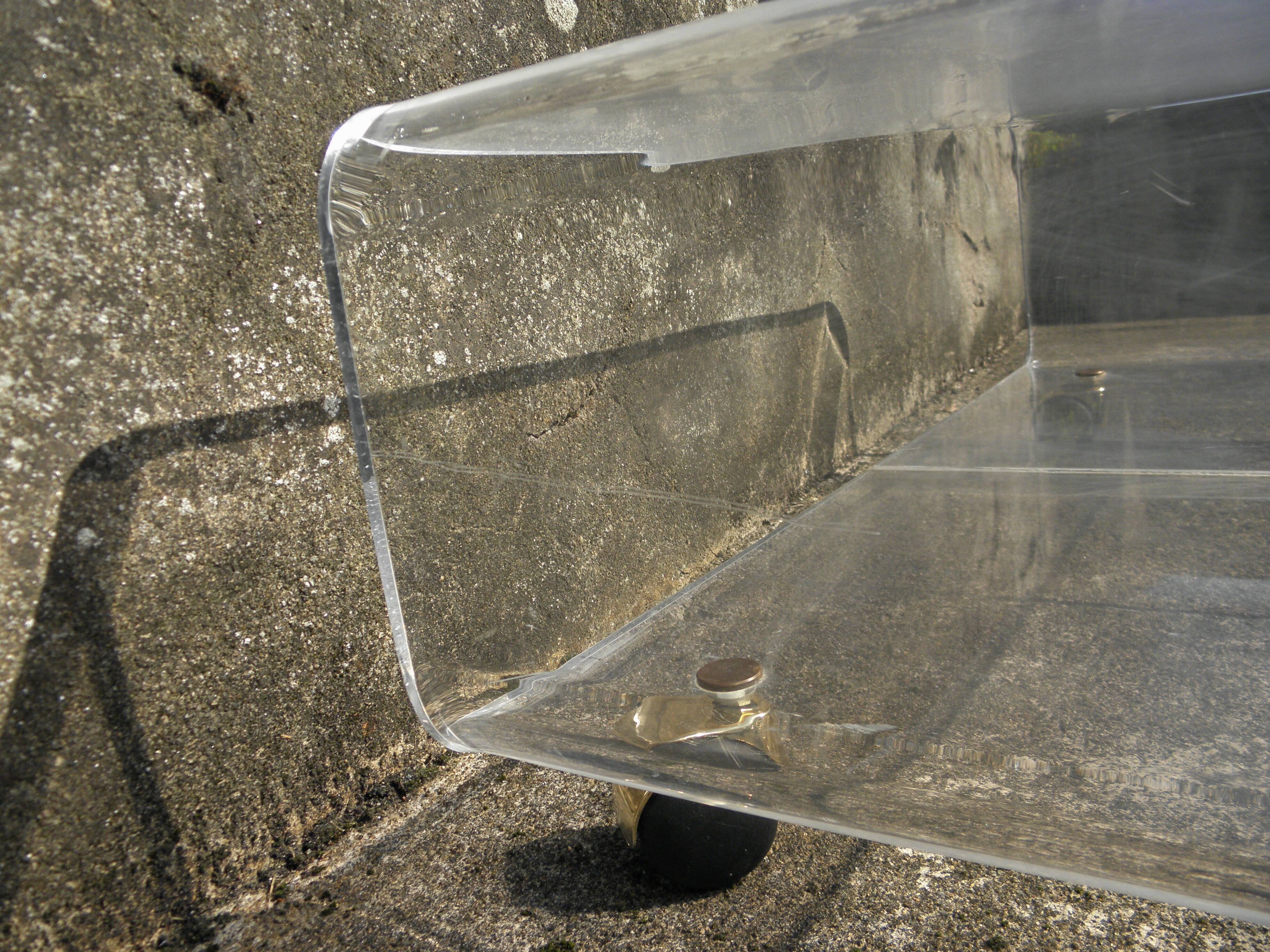 Plexiglass coffee table on wheels
