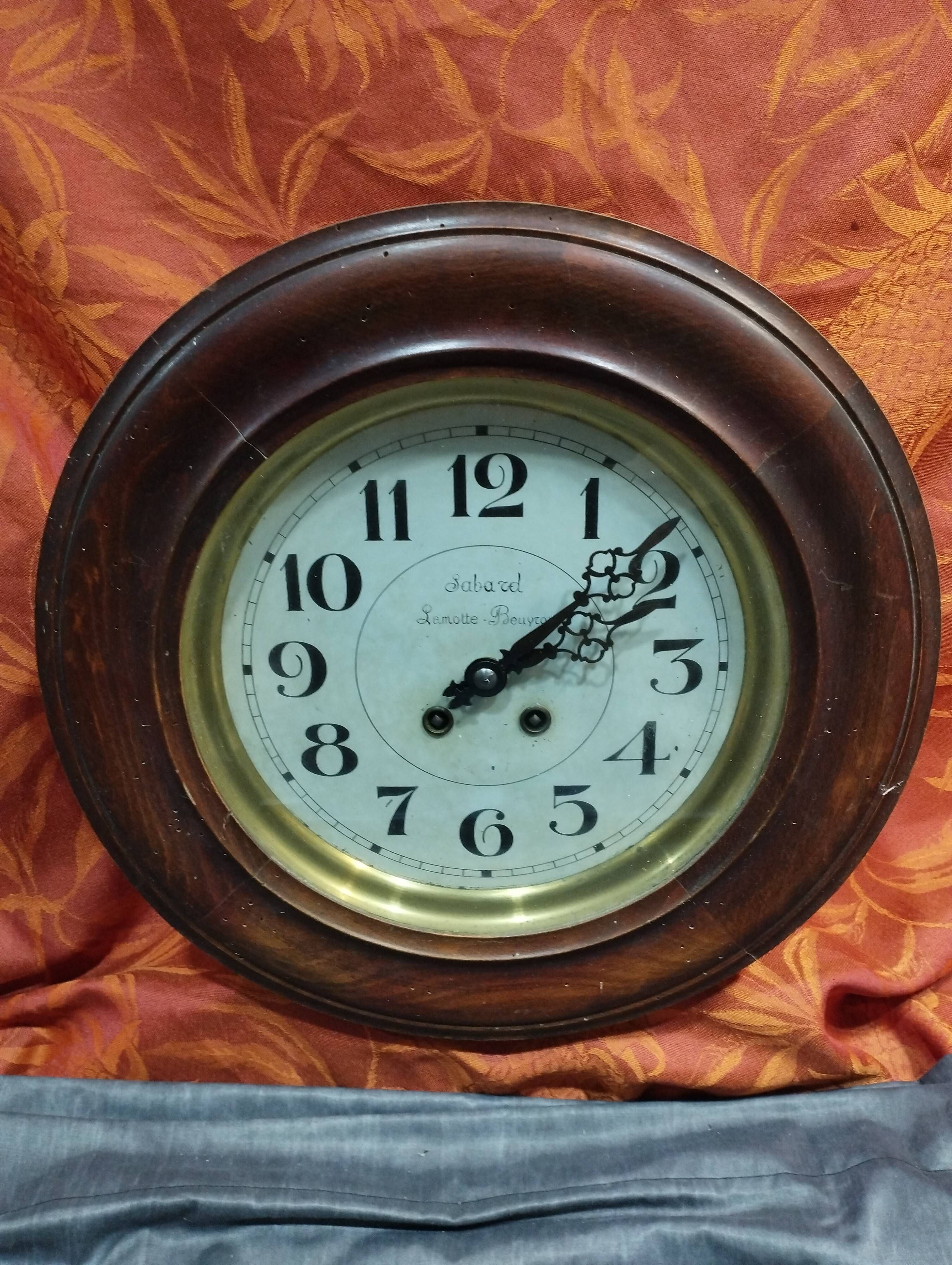 Old round porthole bull's eye wall clock in its wooden case + pendulum + key