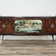 1950s mahogany sideboard with a glass top and central bar.