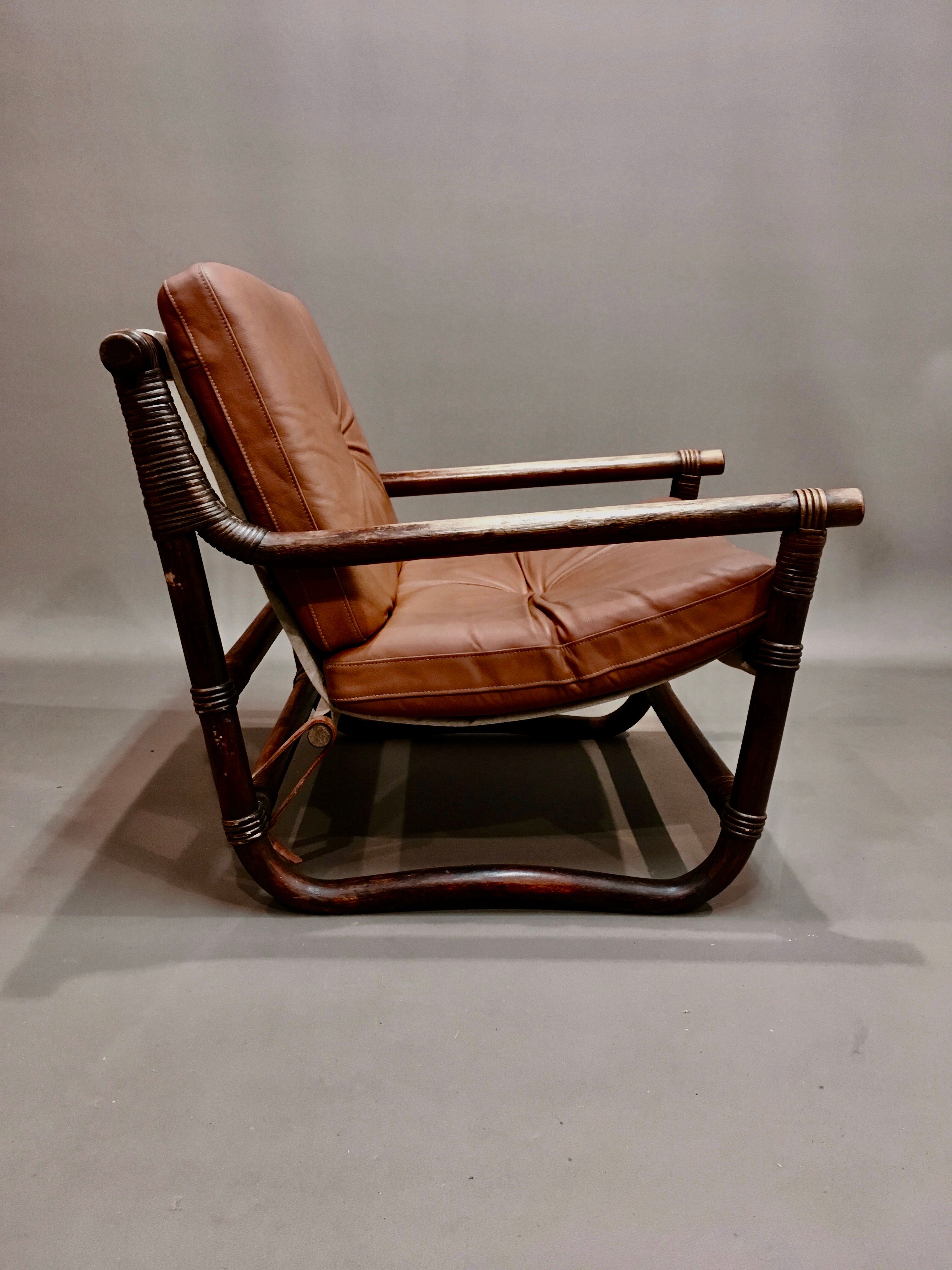 Fauteuil et son ottoman rotin et cuir 1950