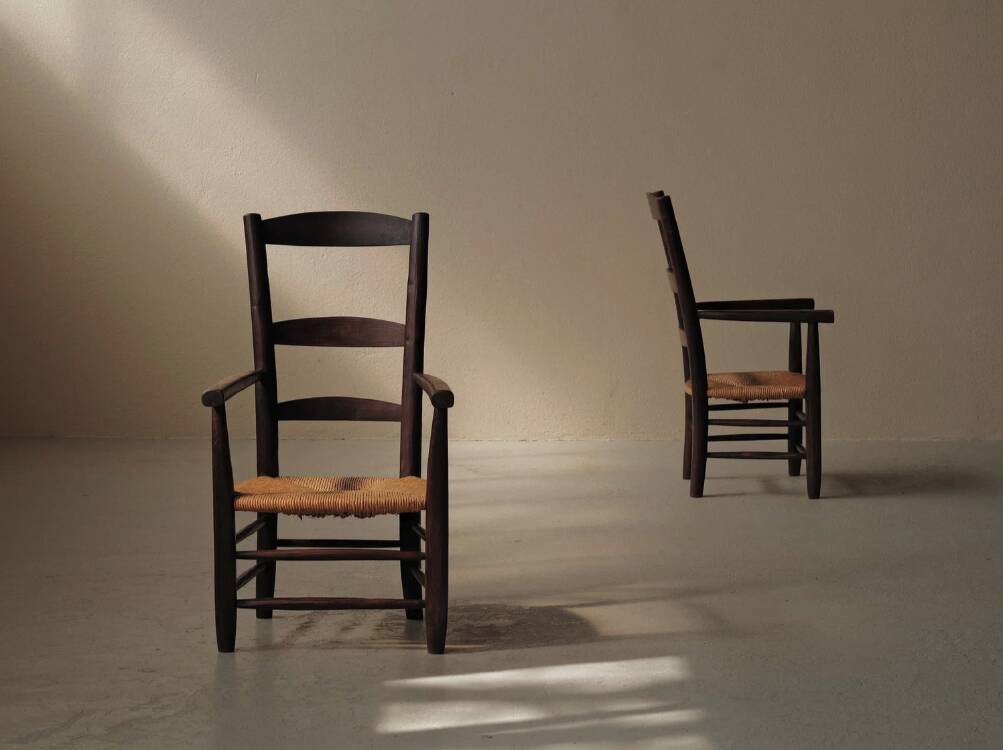 Pair of solid wood and straw armchairs, France, circa 1950.