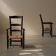 Pair of solid wood and straw armchairs, France, circa 1950.