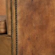 Comfortable sheepskin club armchair in a cognac colour