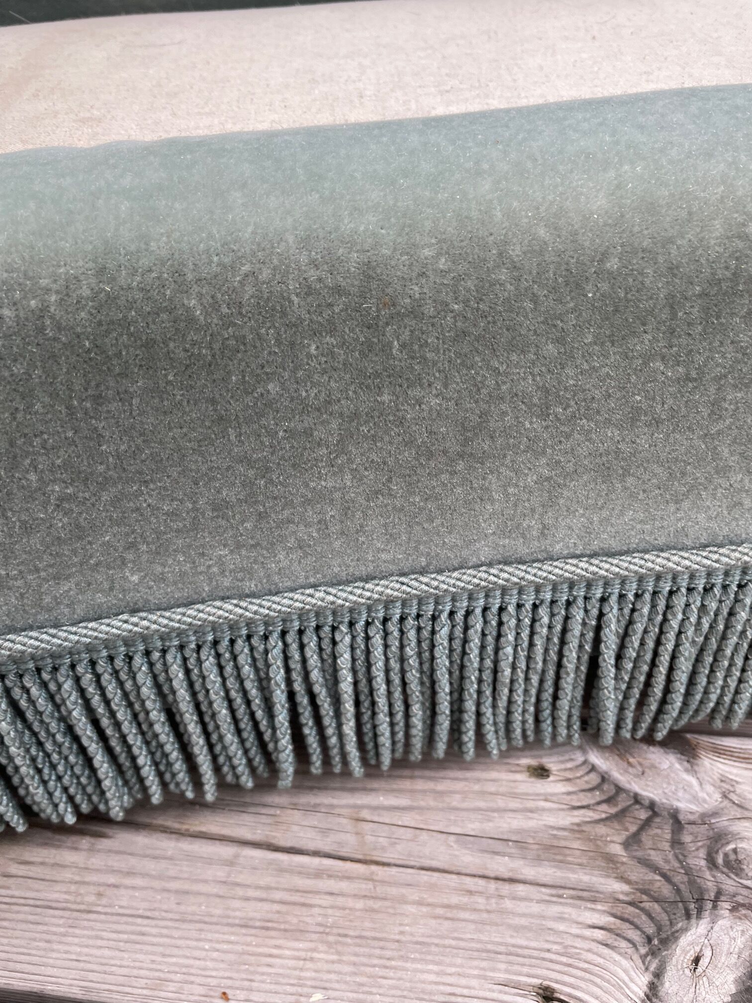 Rounded sofa with fringes
