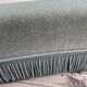 Rounded sofa with fringes