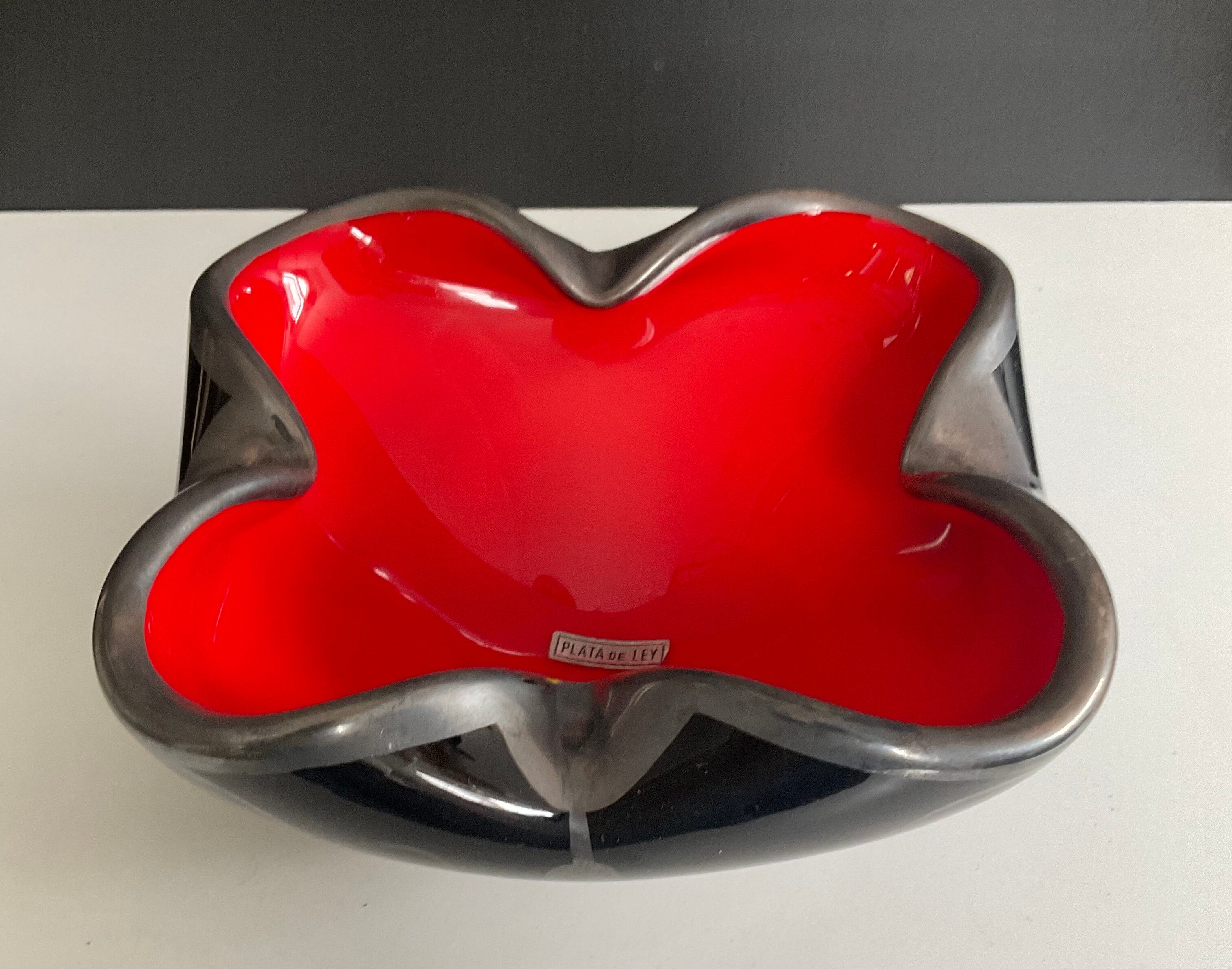 Vintage glass and silver catchall.