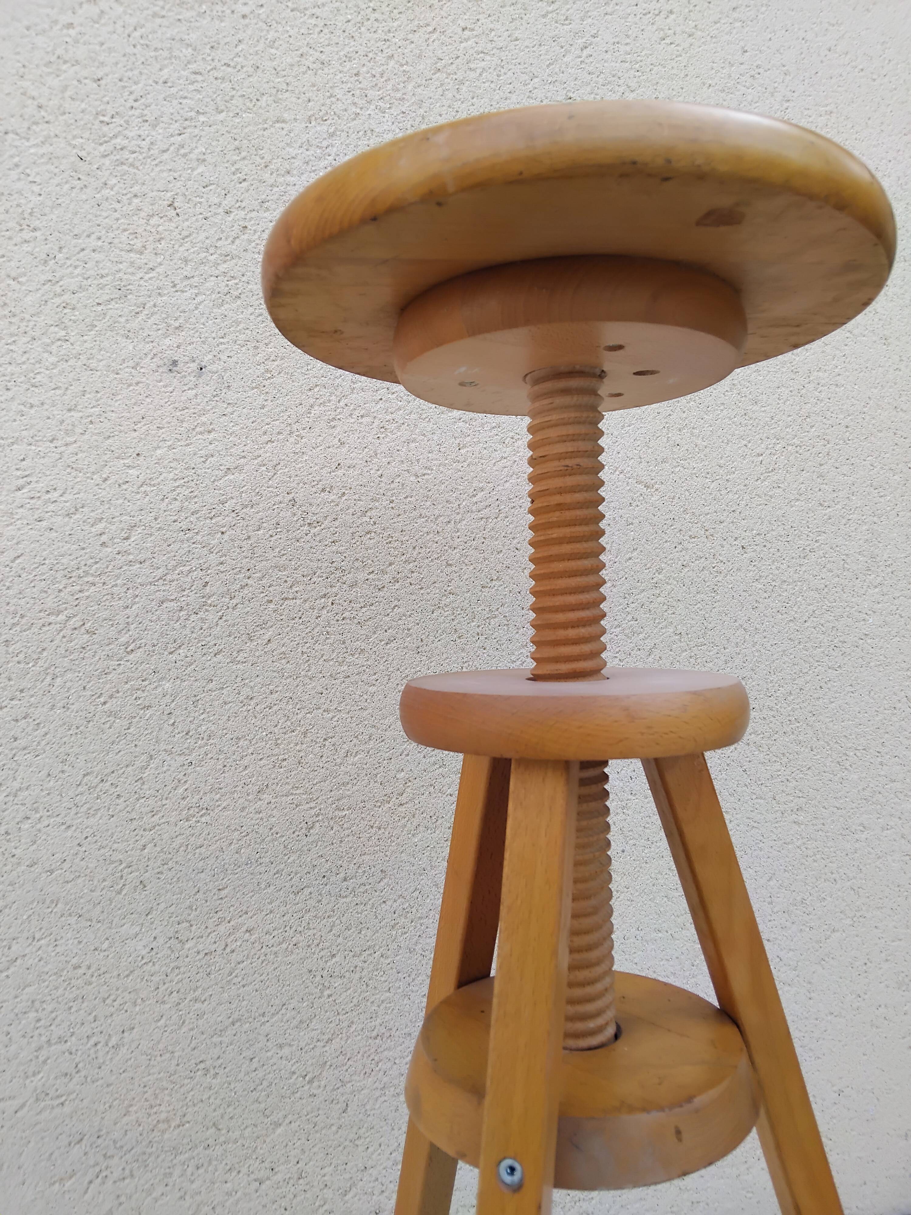 Adjustable tripod screw stool for painter artist workshop.