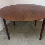 Scandinavian extendable round dining table in teak