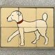 Wooden puzzle frame from the 1930s/40s depicting a dog.