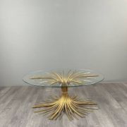 Gold metal and glass coffee table, 20th century, in the style of Robert Goos.