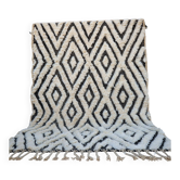 Tapis berbère en laine écrue à motifs noirs