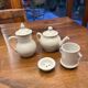 Antique white earthenware teapot, individual service with filter.