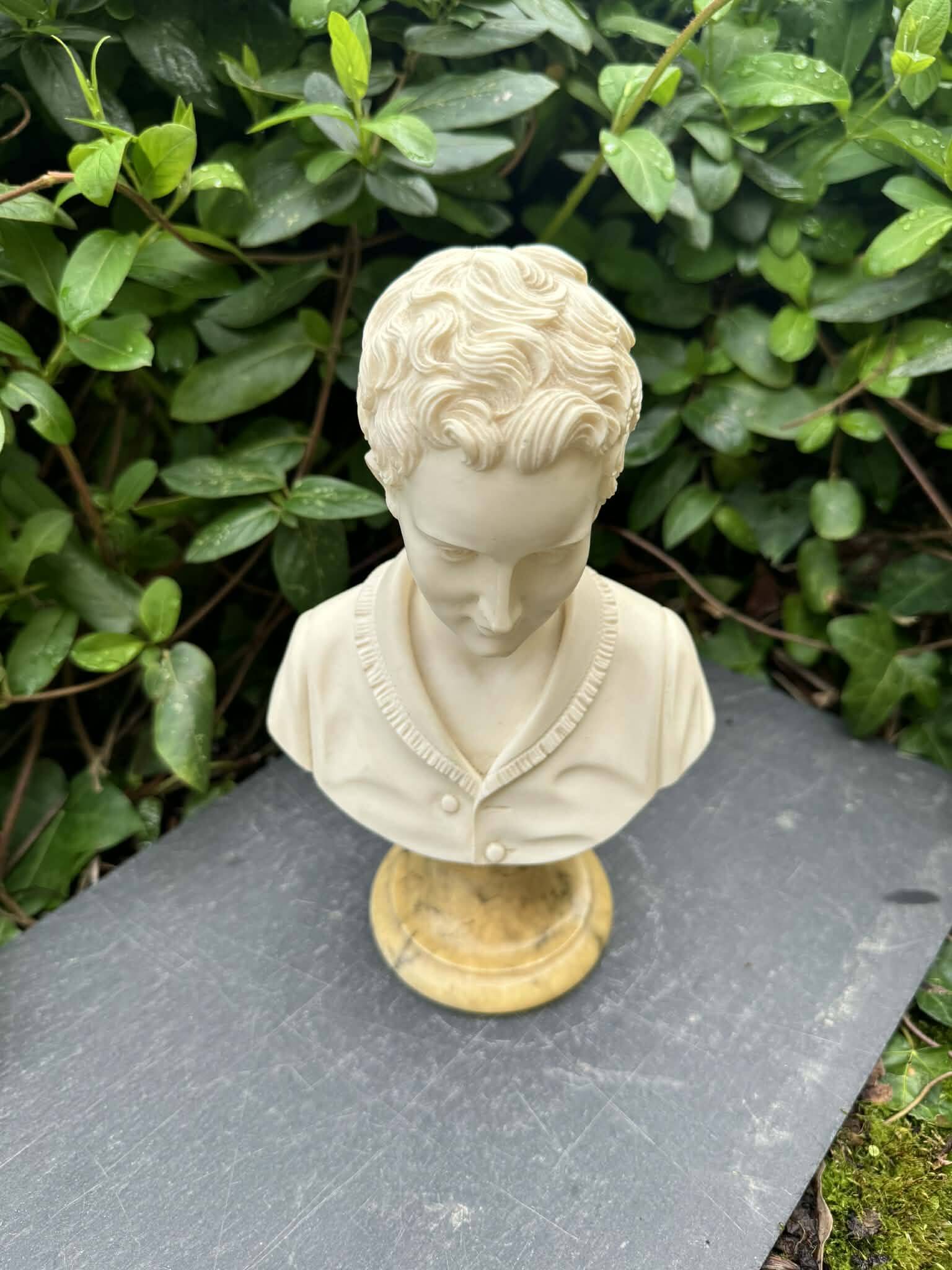 Alabaster bust of a woman signed Arnaldo Giannelli.