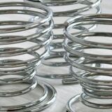 4 stainless steel egg cups.