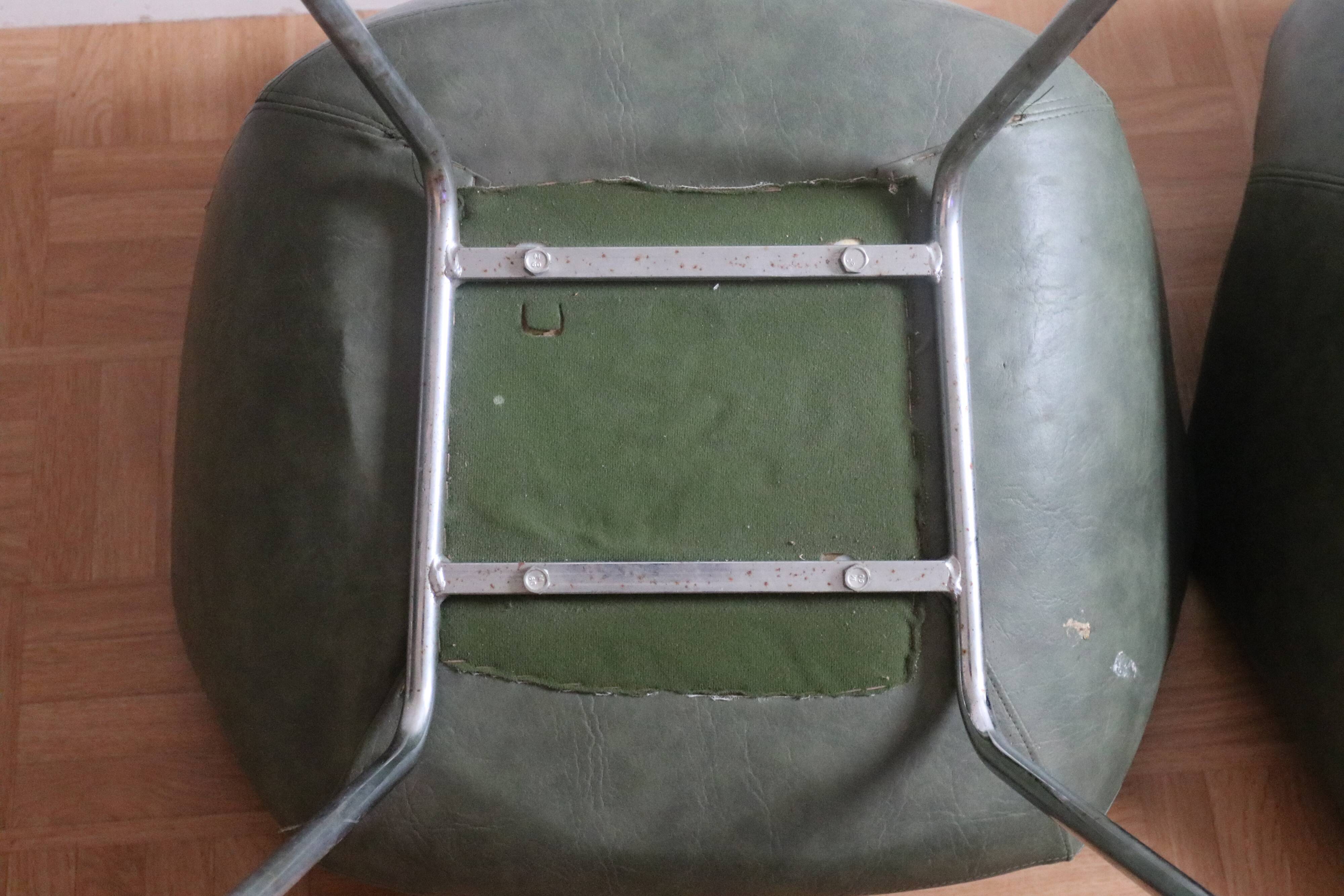 Three green skai chairs with chrome feet