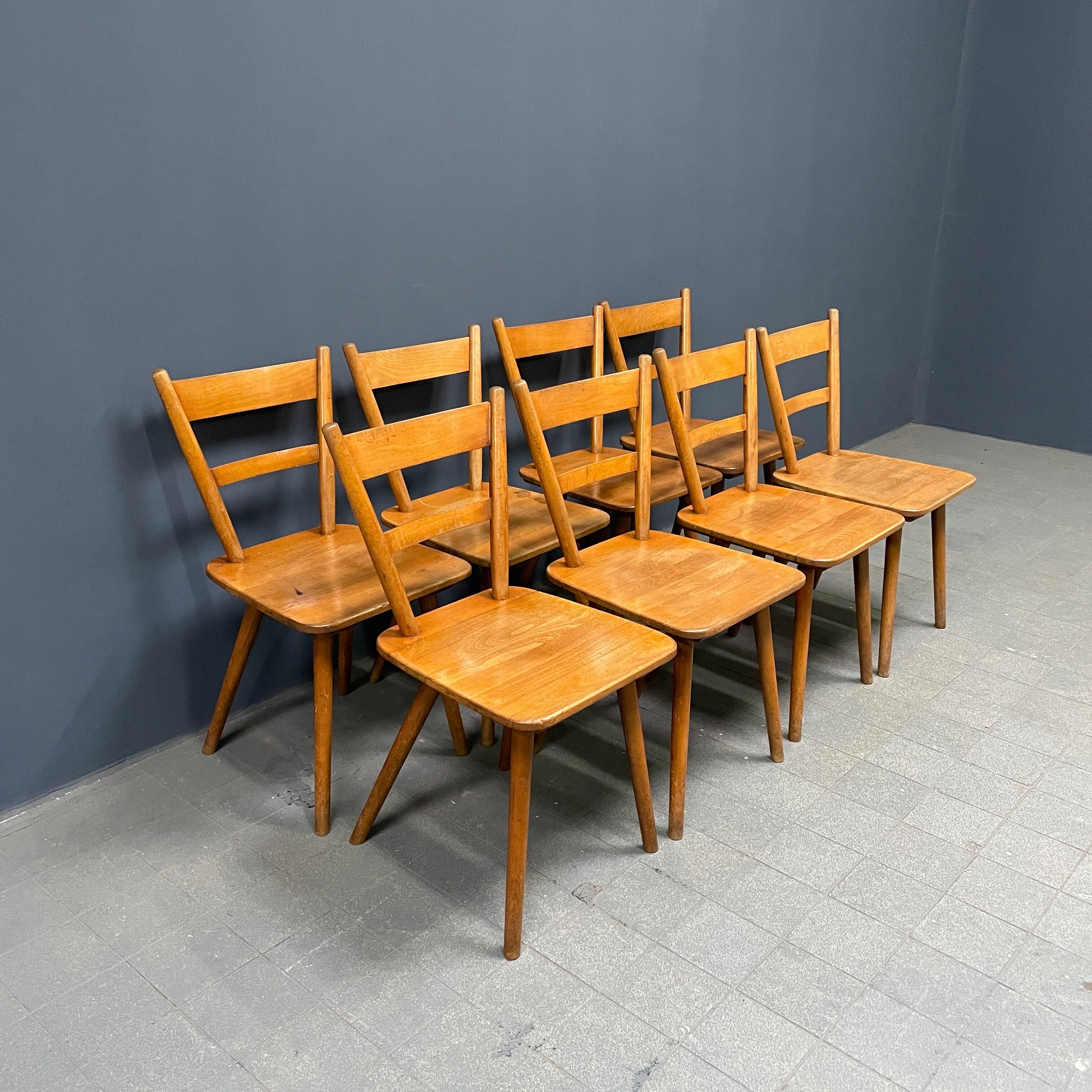 Set of eight german stick chairs from the 1950
