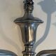 A pair of important Louis XVI style silver-plated wall sconces with three light arms.