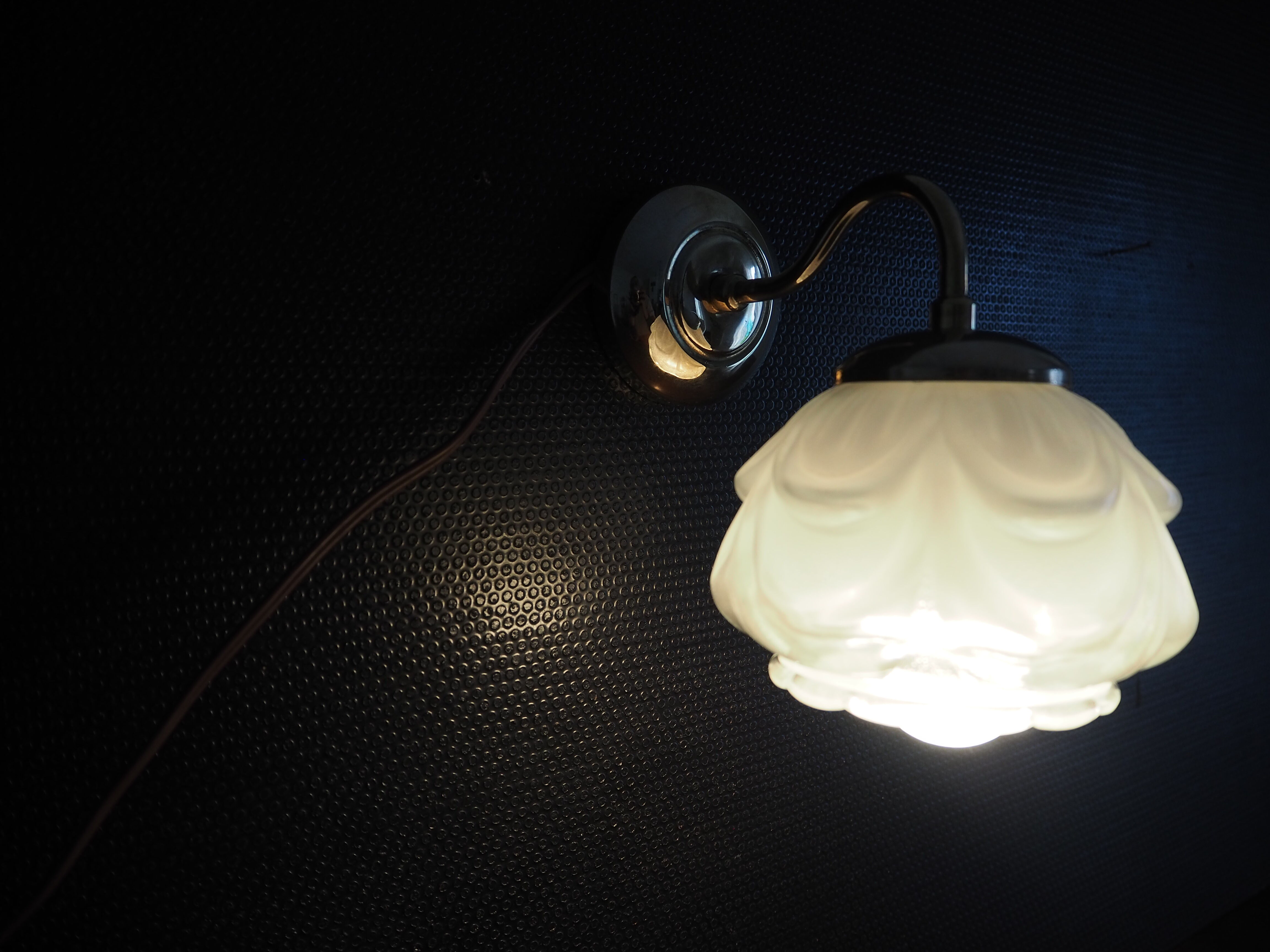 Brass wall lamp and white glass globe from the 1950s-1960s.