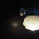 Brass wall lamp and white glass globe from the 1950s-1960s.