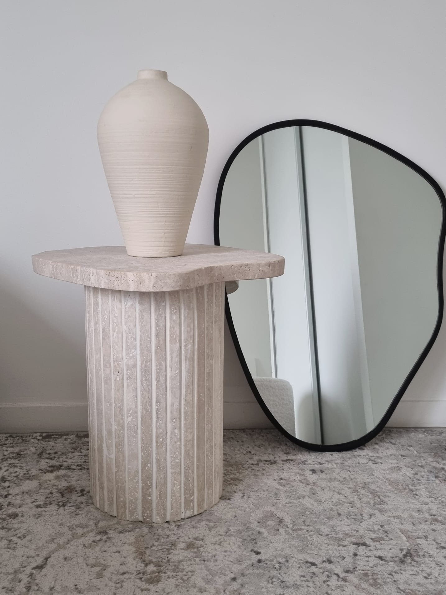 Alpha side table irregular natural travertine ribbed foot