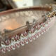 Vintage suspension in frosted pink glass with pearl pendants.