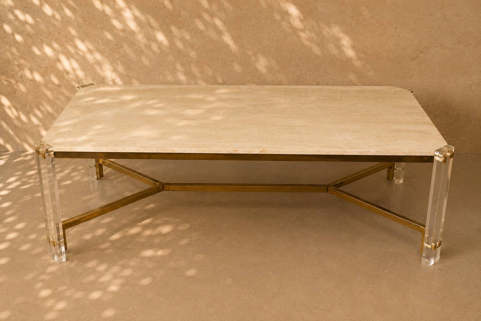 1970s dining table in travertine, gold metal and plexiglass.