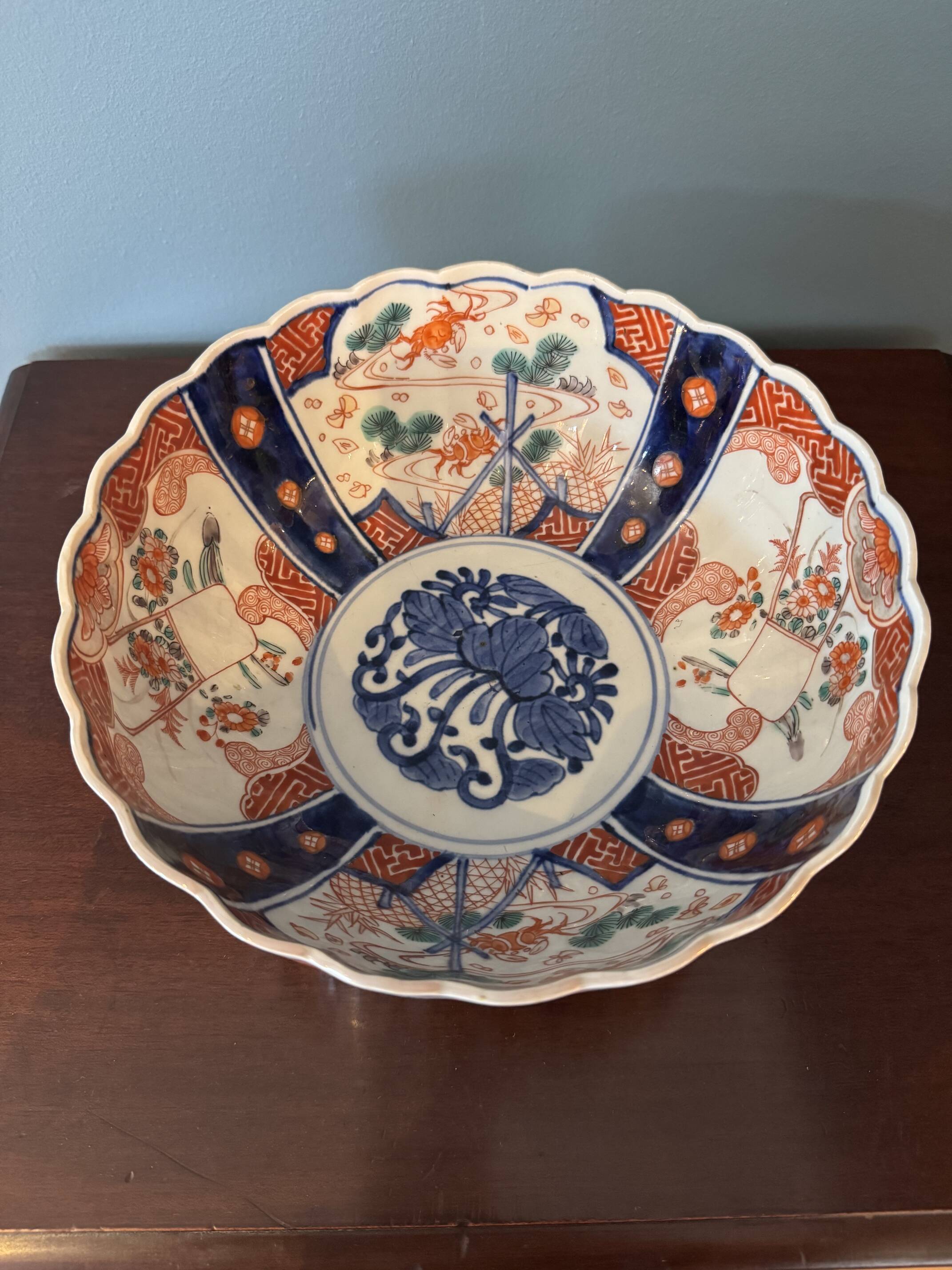 Hand-painted Imari porcelain bowl with an elegant scalloped rim
