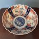 Hand-painted Imari porcelain bowl with an elegant scalloped rim