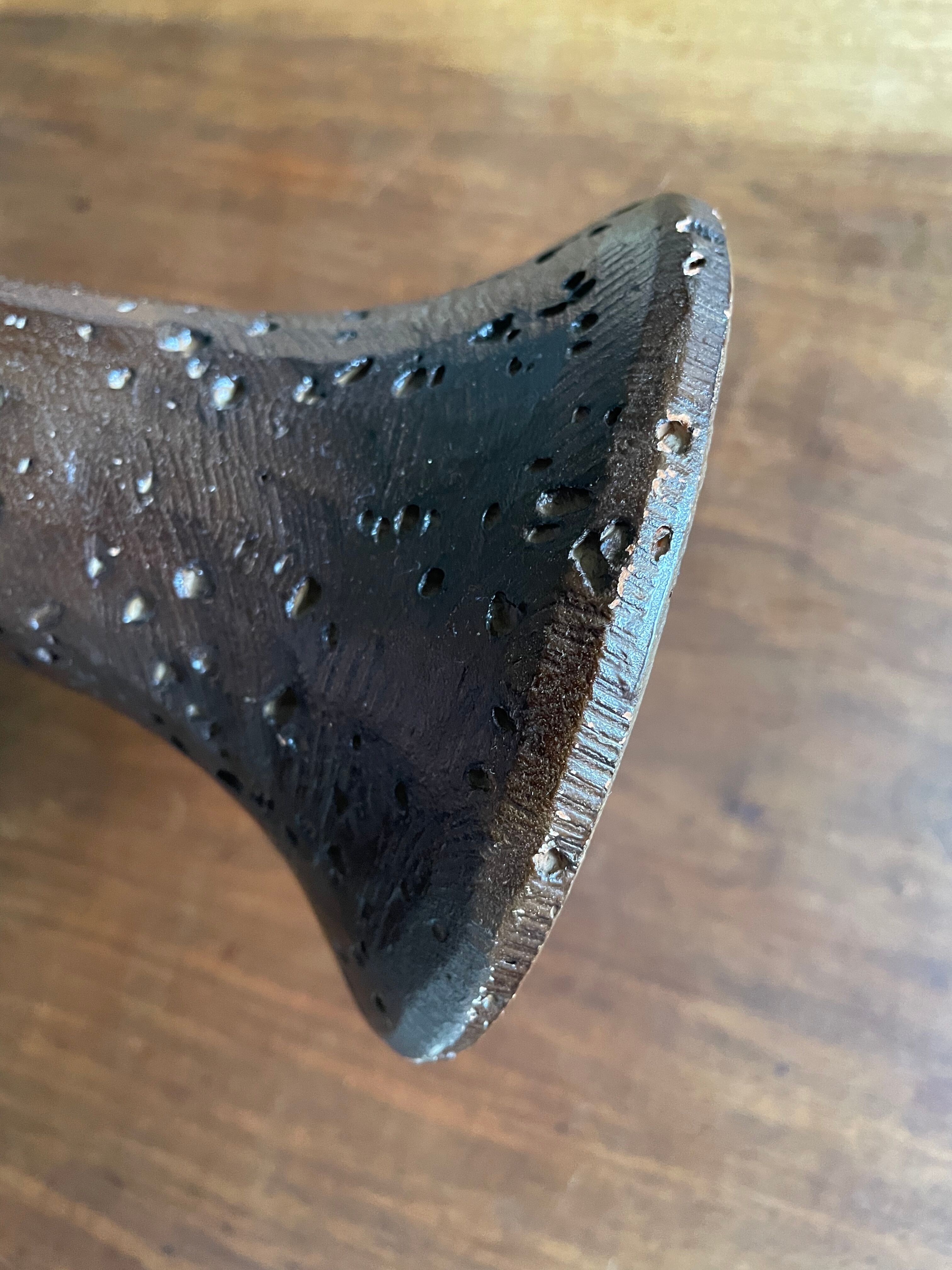 Brown enamelled terracotta candle holder